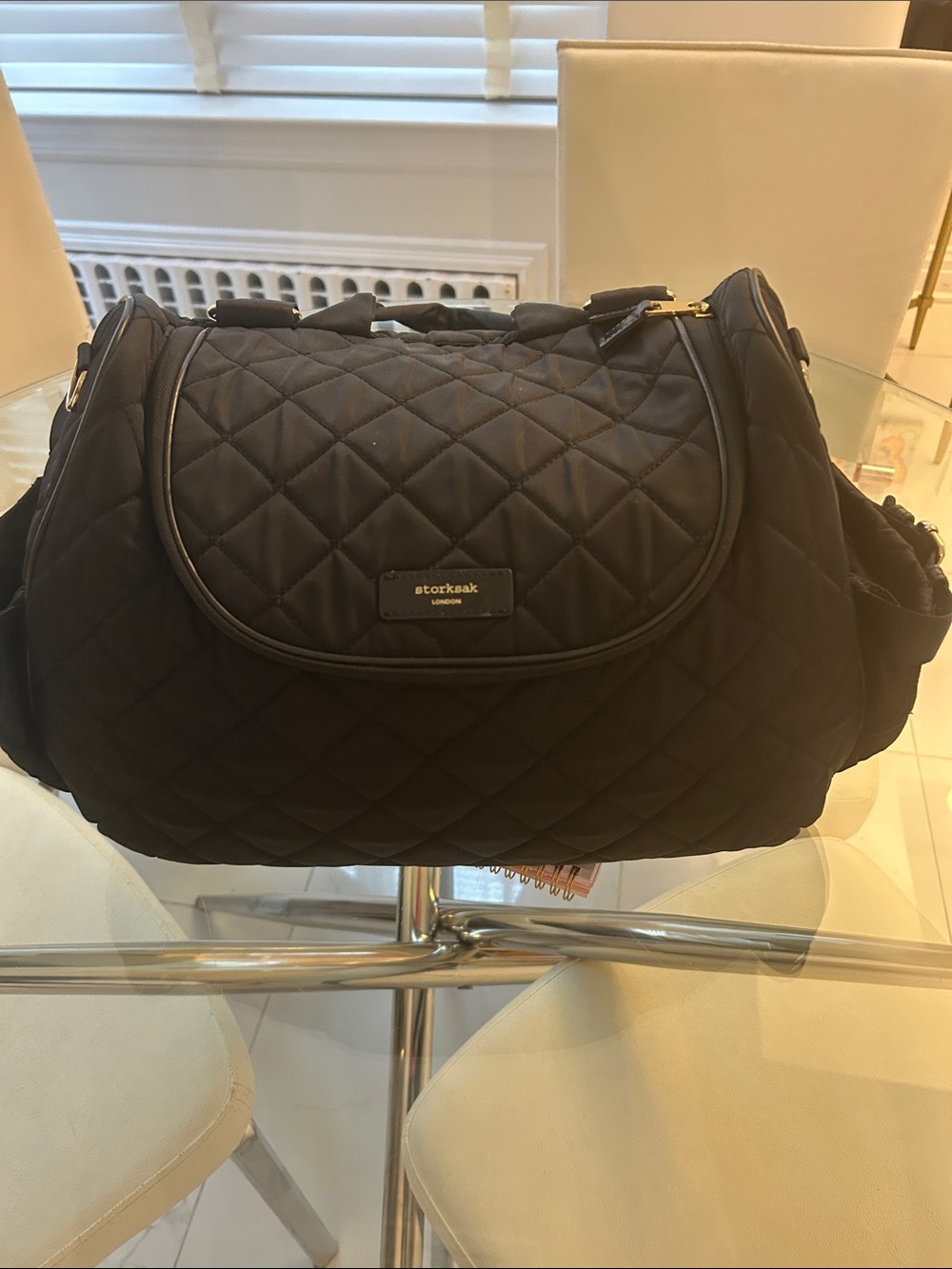 Storksak Black Quilted Travel Bag with Gold Accents
